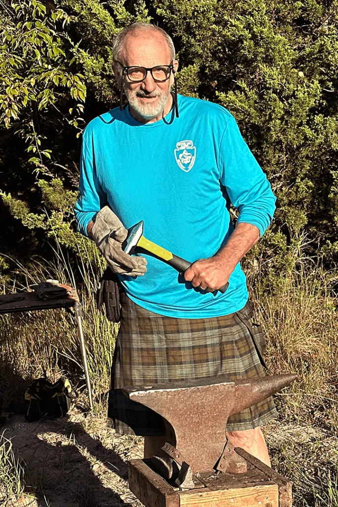 Raymond Monroe of Steel Founder's Society of America holding an Estwing Sure Strike 32-oz. Blacksmith Hammer.